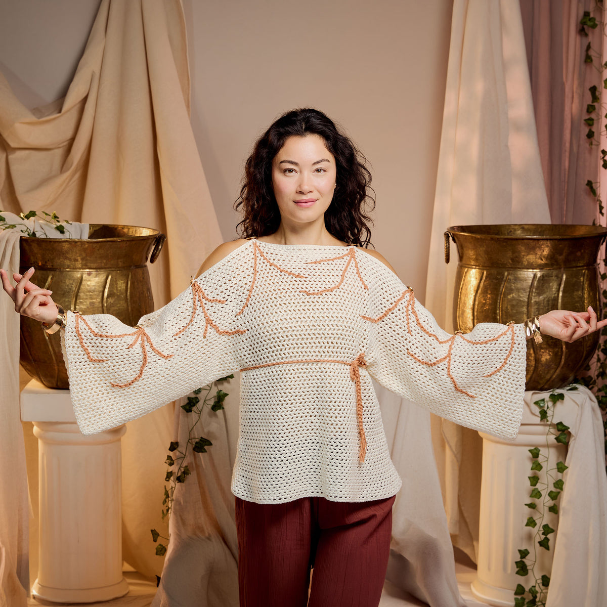 Crochet Grecian Top made using Bernat yarn in a styled lifestyle setting