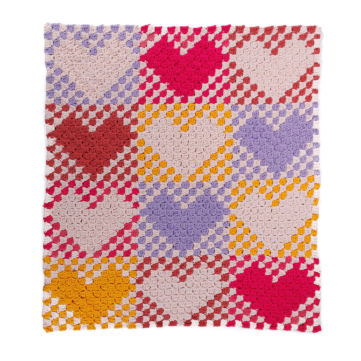 With All My Heart Crochet Blanket made using Bernat yarn on a white background
