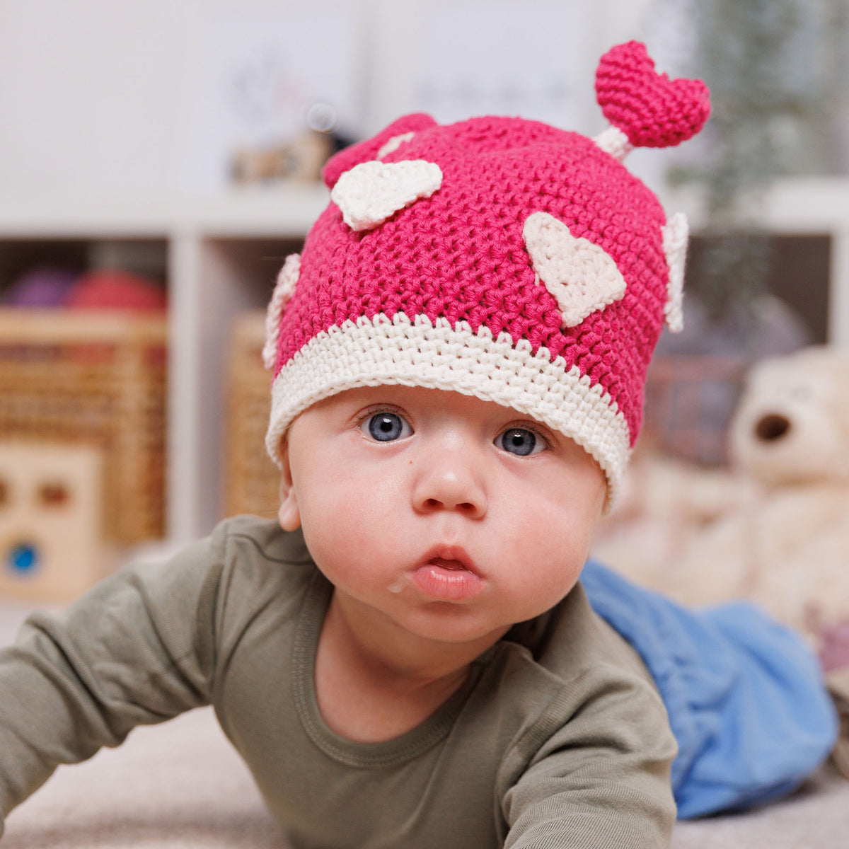 Crochet Luv Bug Hat made using Bernat yarn in a styled lifestyle setting