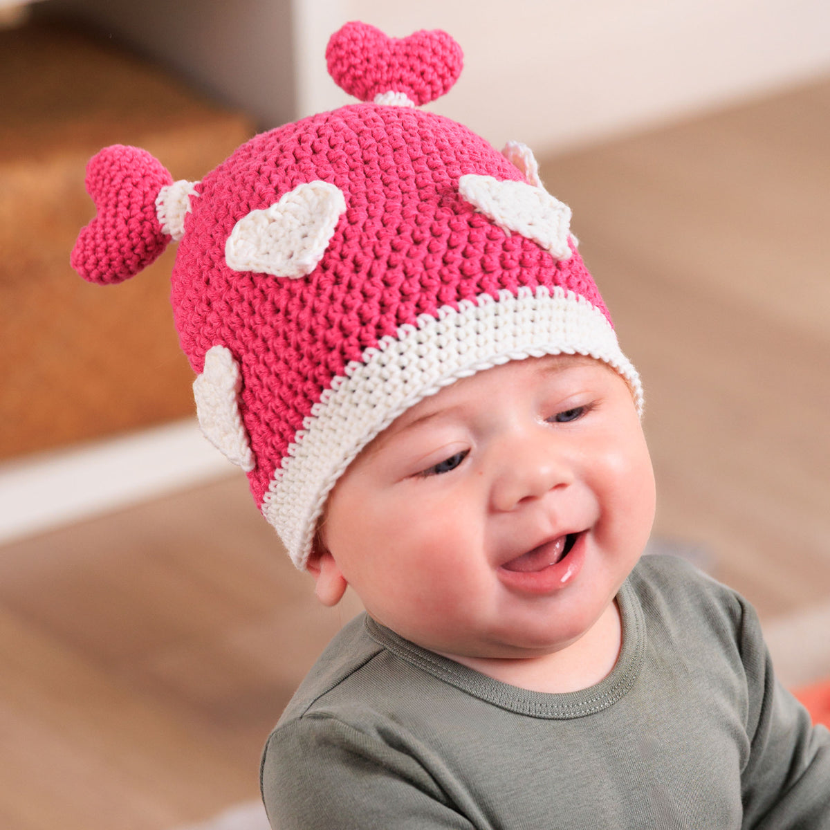 Crochet Luv Bug Hat made using Bernat yarn in a styled lifestyle setting