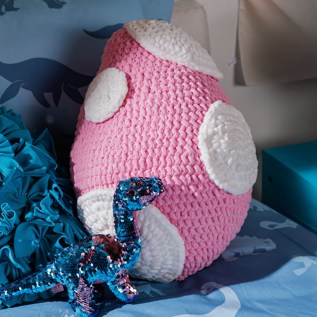 Crochet Dinosaur Egg Pillow made using Bernat yarn