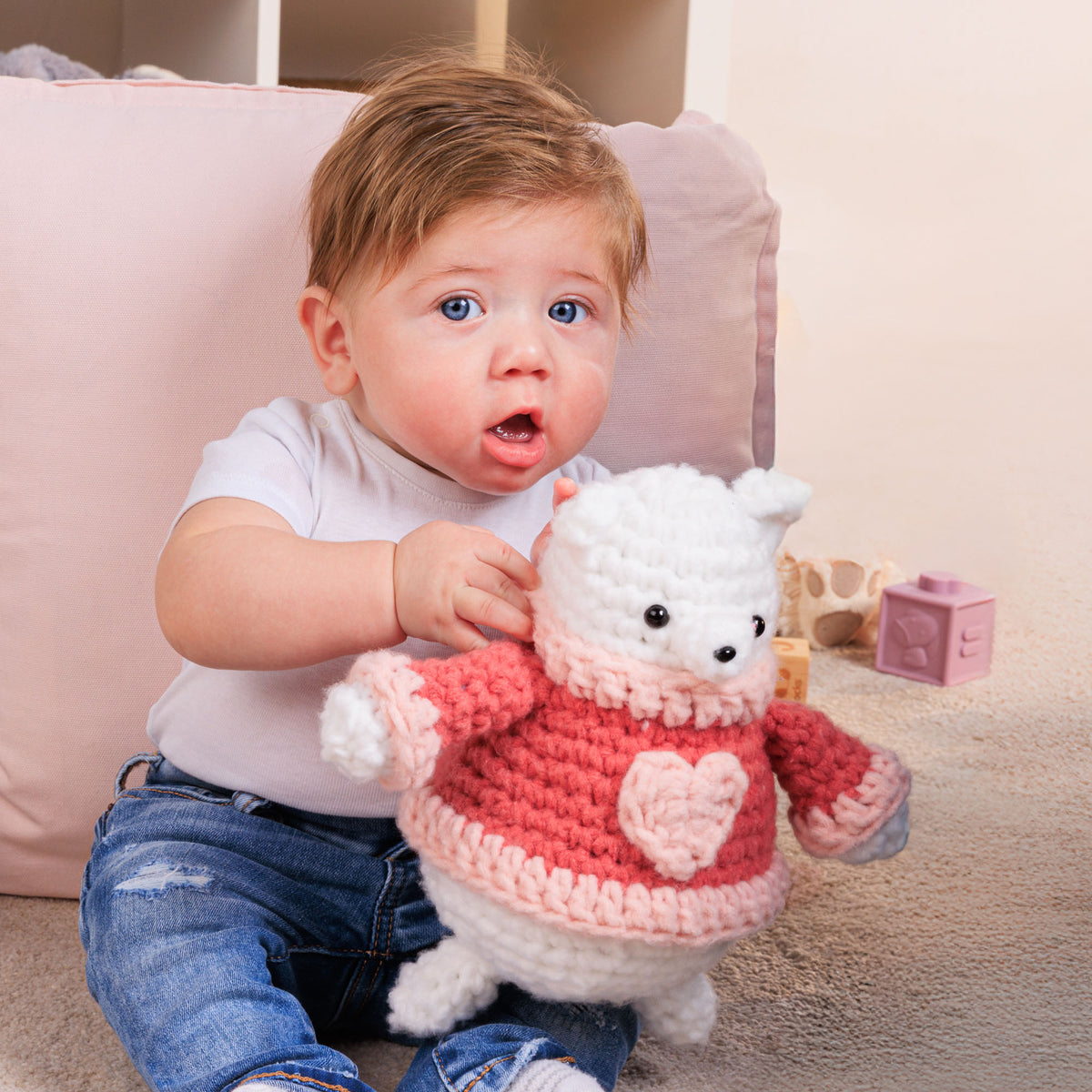 Heartley The Crochet Bear made using Bernat yarn in a styled lifestyle setting