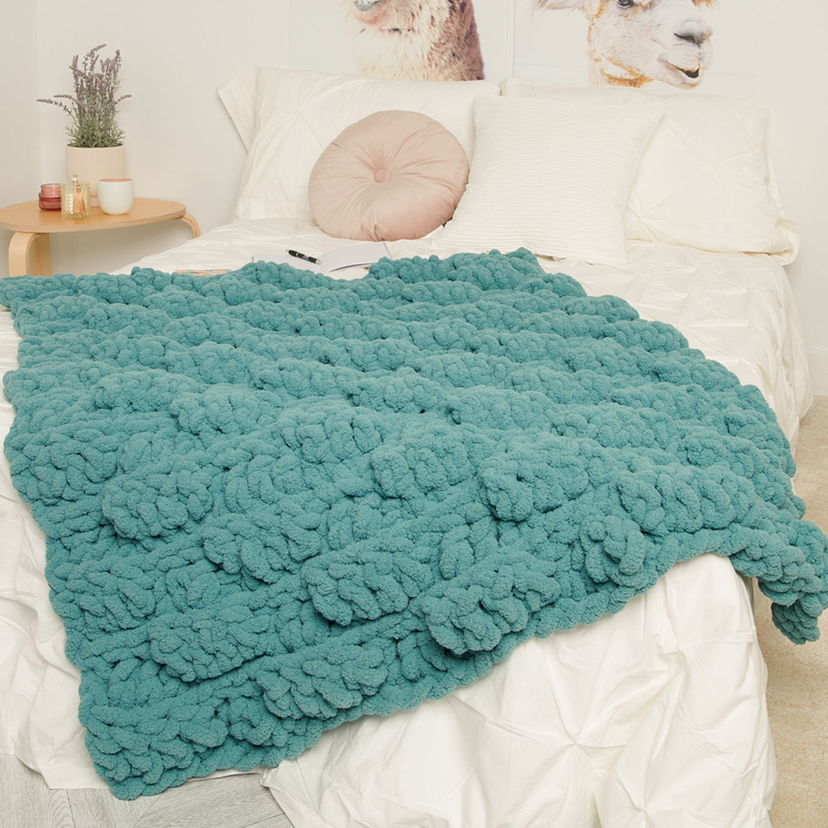 Puff Piece Crochet Lap Blanket made using Bernat yarn in a styled lifestyle setting