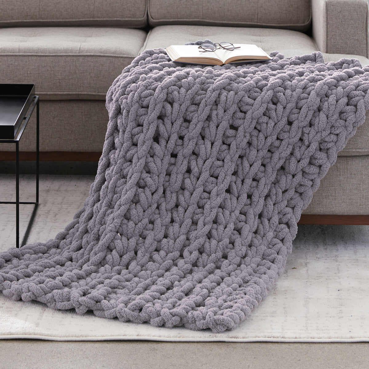 Ridge & Repeat Crochet Throw made using Bernat yarn in a styled lifestyle setting