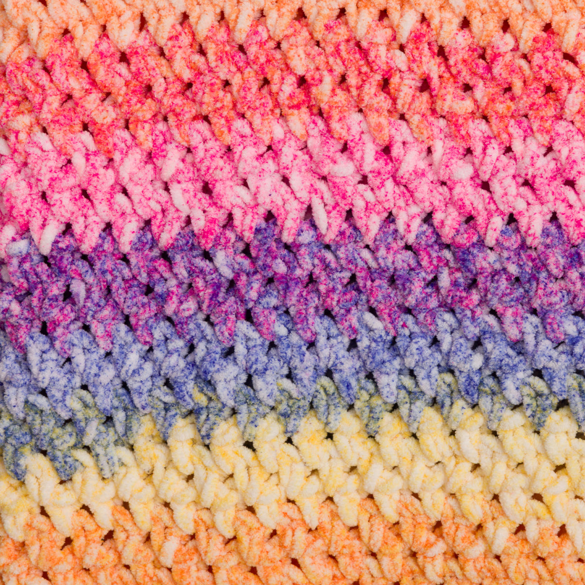 Morning Moss-Stitch Crochet Blanket made using Bernat yarn in a styled lifestyle setting