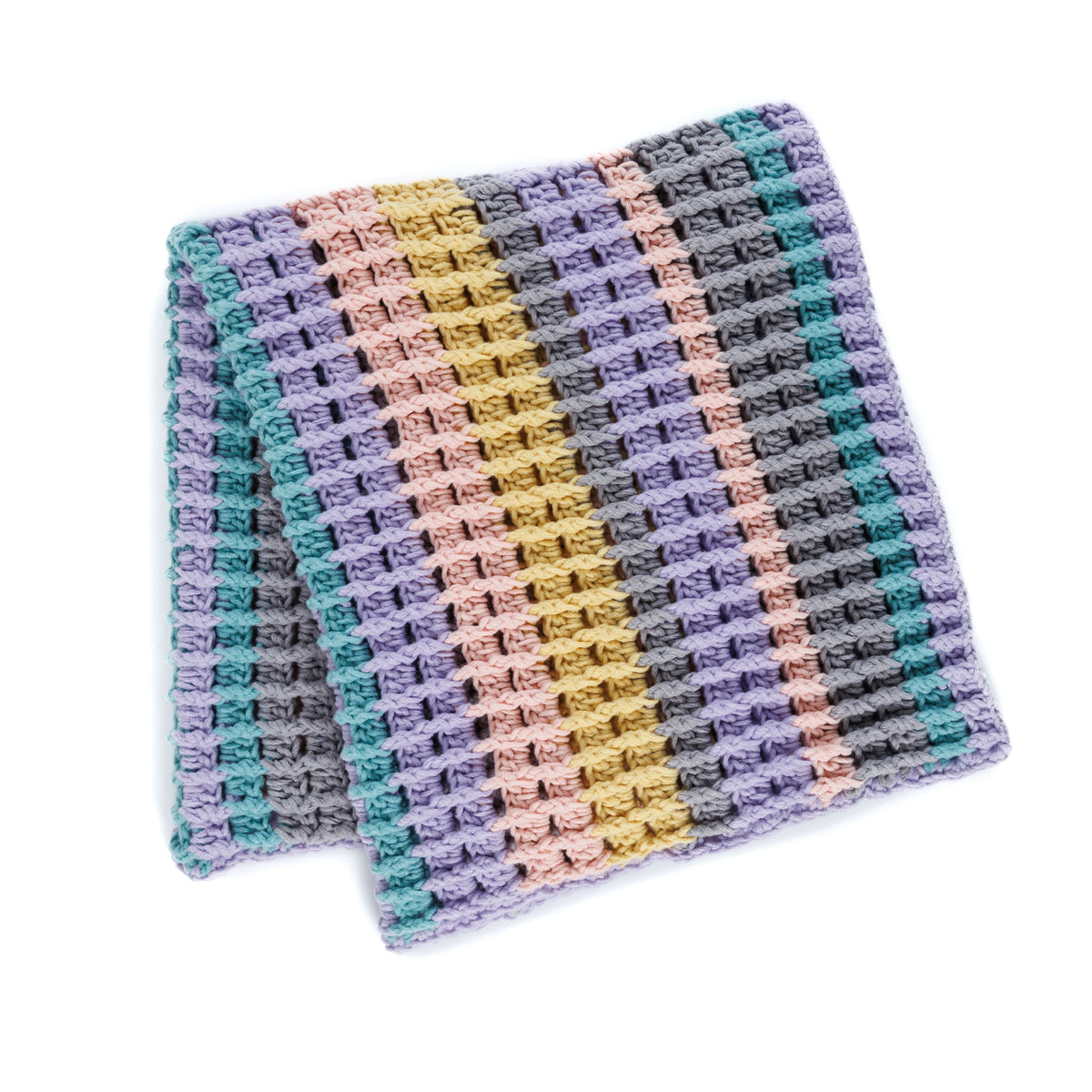 Suit Your Mood Crochet Blanket made using Bernat yarn in a styled lifestyle setting