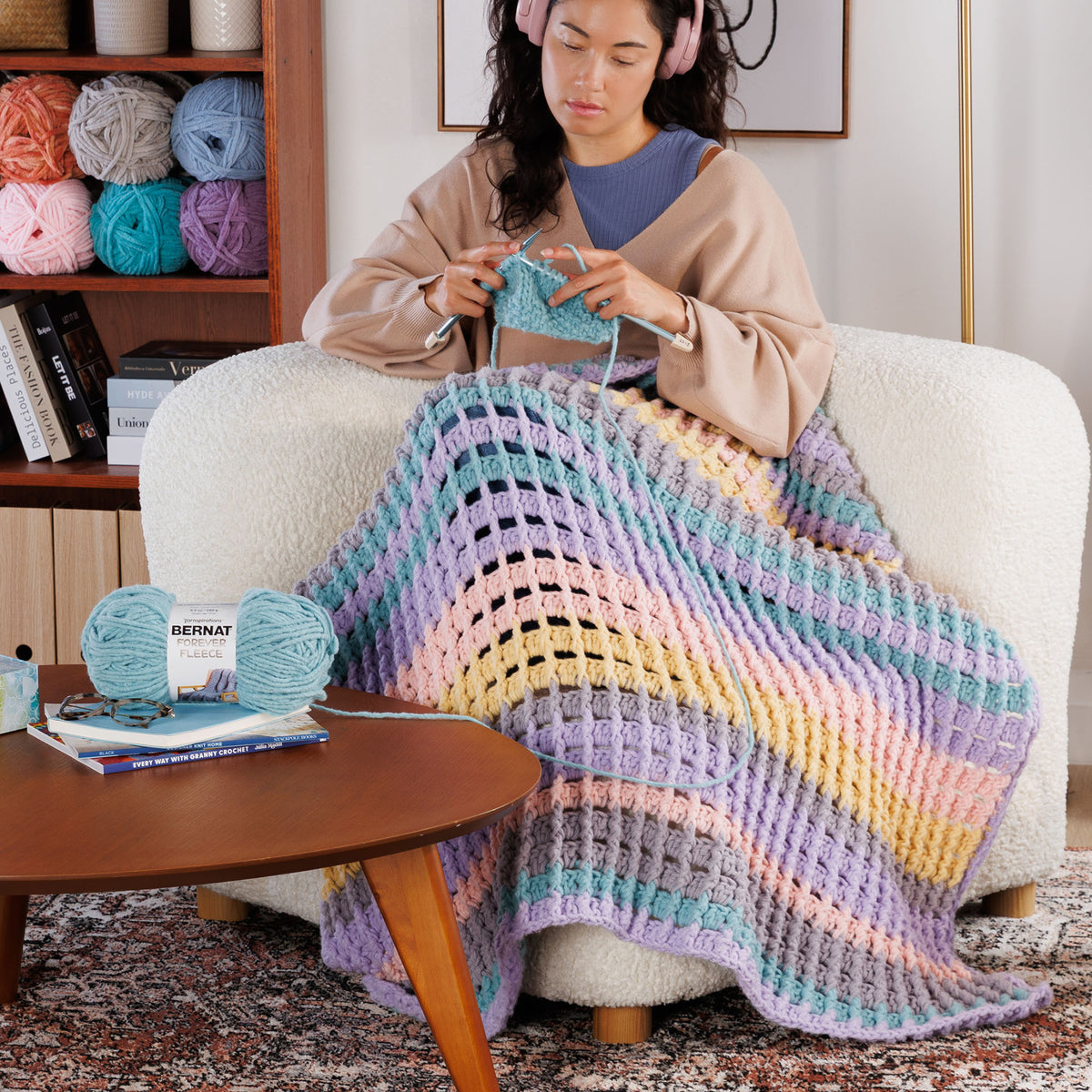 Suit Your Mood Crochet Blanket made using Bernat yarn in a styled lifestyle setting