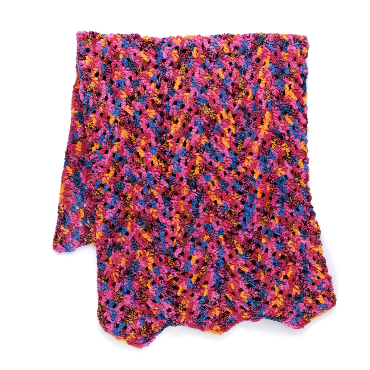 Candy Crochet Chevron Blanket made using Bernat yarn in a styled lifestyle setting