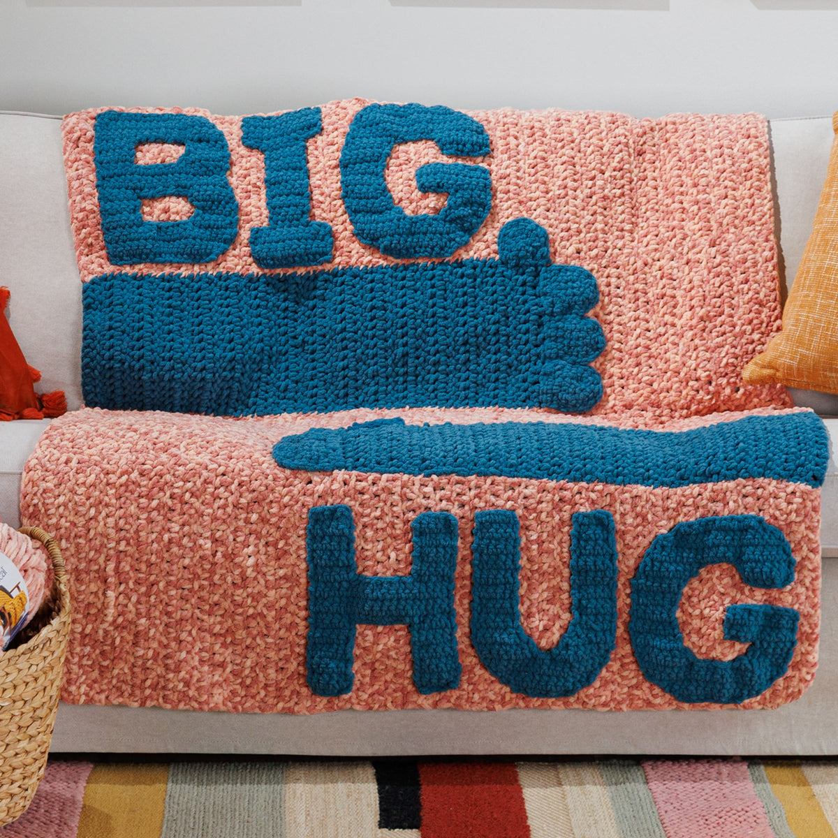 Crochet Biggest Hug Blanket made using Bernat yarn in a styled lifestyle setting