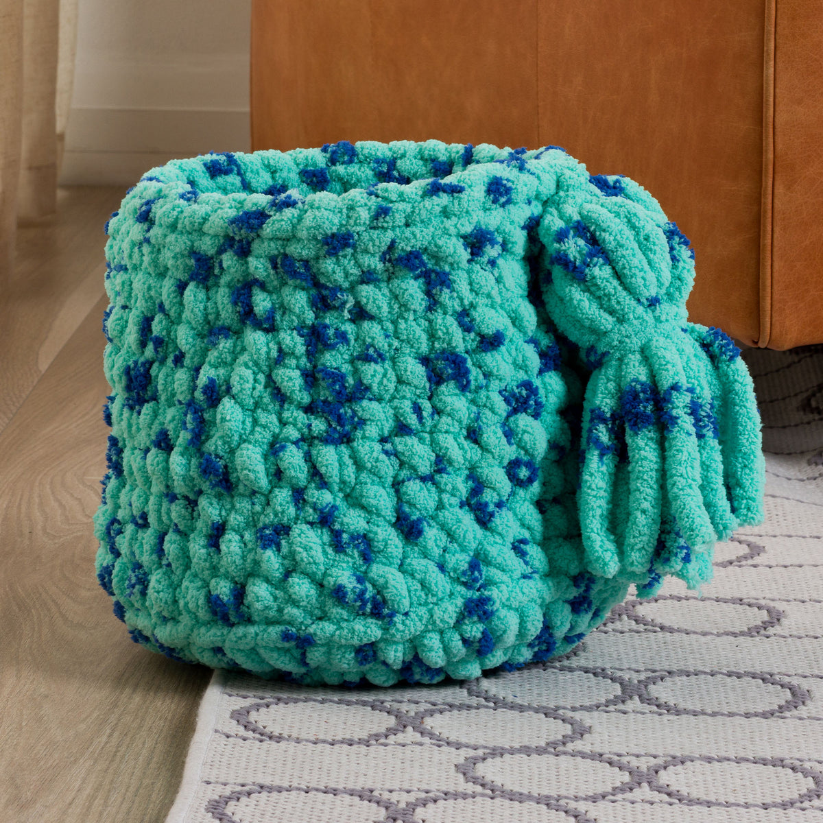 Stitch And Store Crochet Basket made using Bernat yarn in a styled lifestyle setting