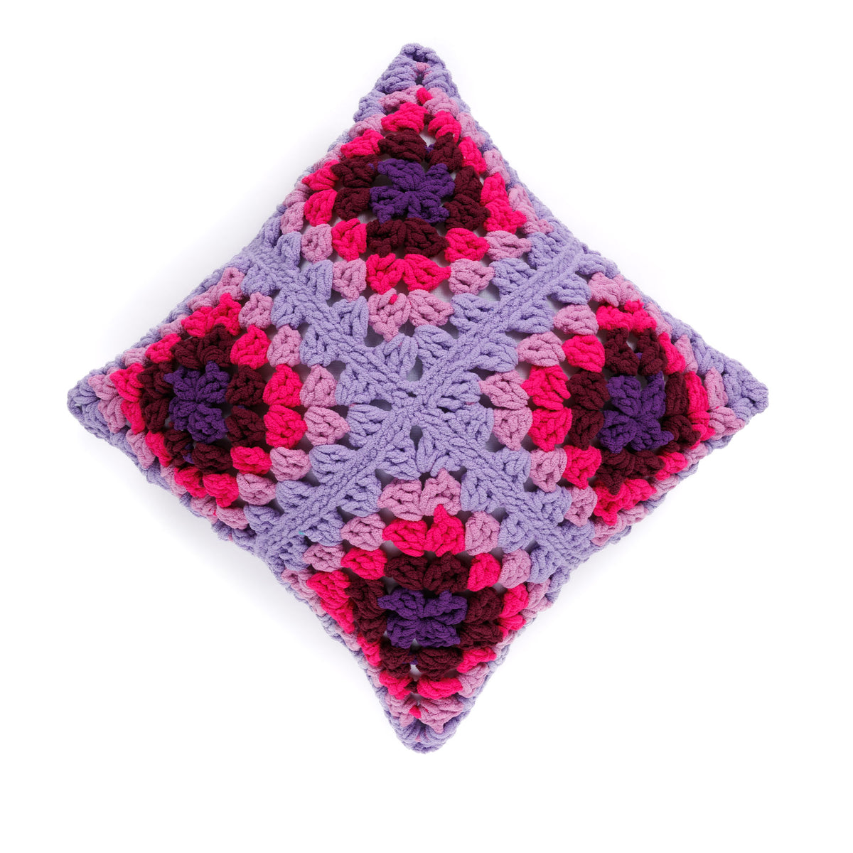 Perfectly Plush Crochet Pillow made using Bernat yarn in a styled lifestyle setting