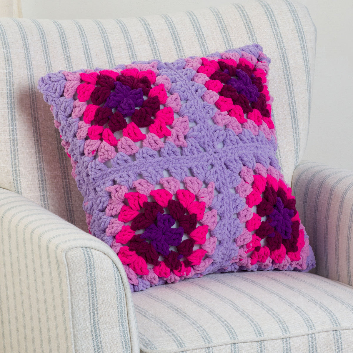 Perfectly Plush Crochet Pillow made using Bernat yarn in a styled lifestyle setting