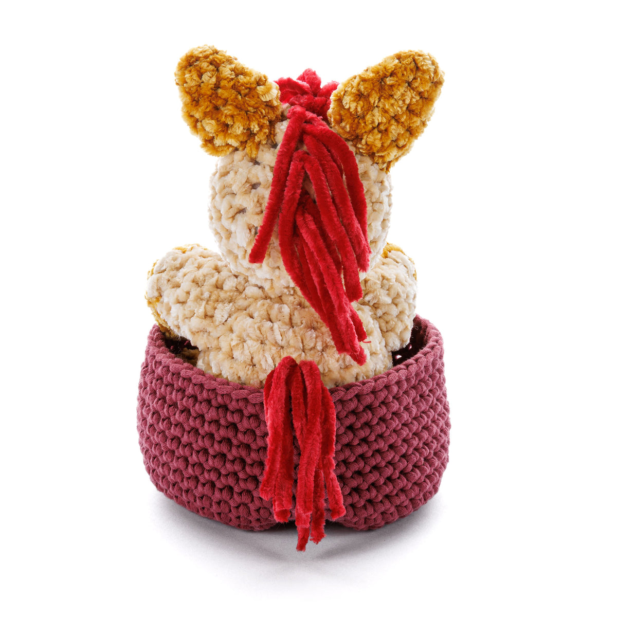 Sleeping Foal To Crochet made using Bernat yarn in a styled lifestyle setting