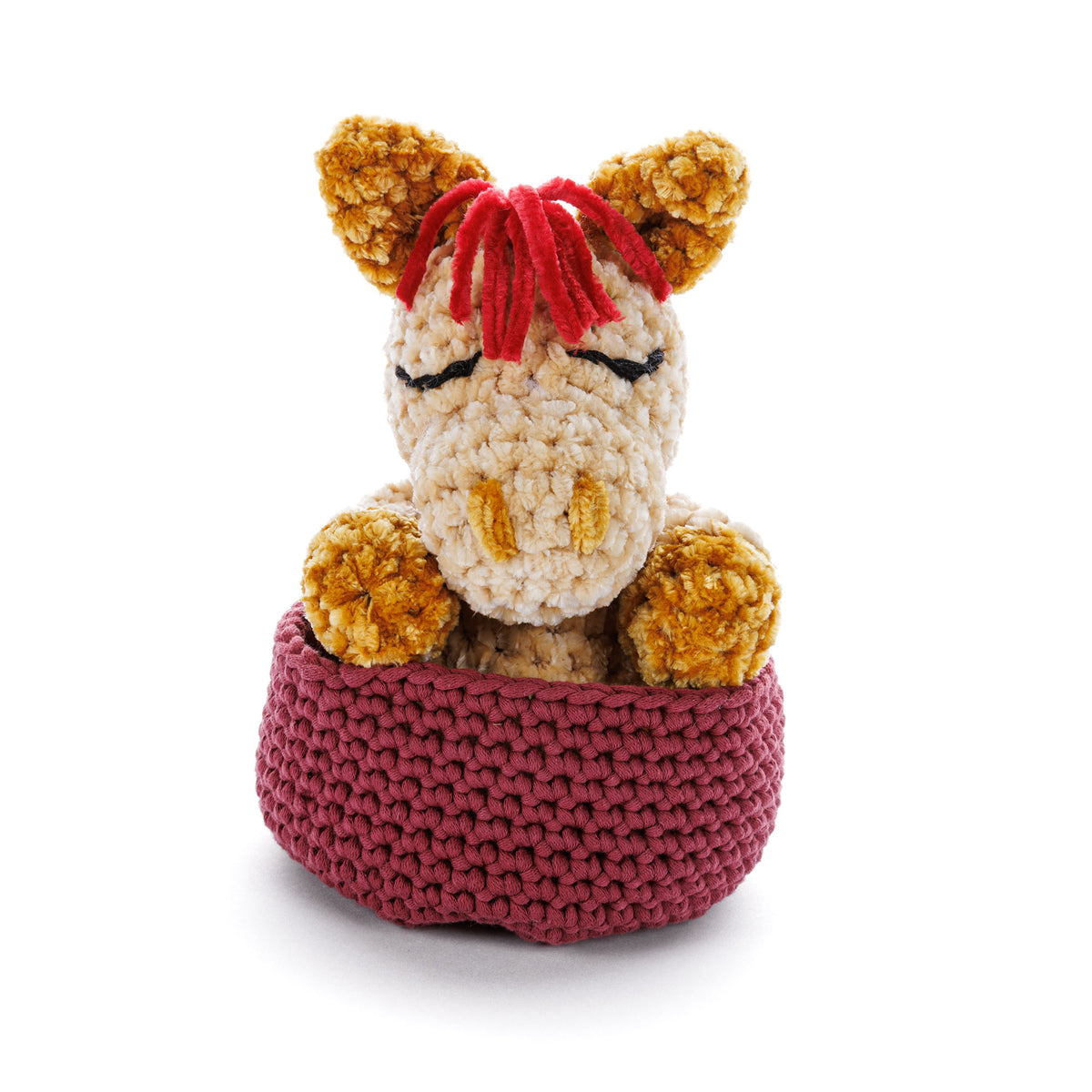 Sleeping Foal To Crochet made using Bernat yarn on a white background