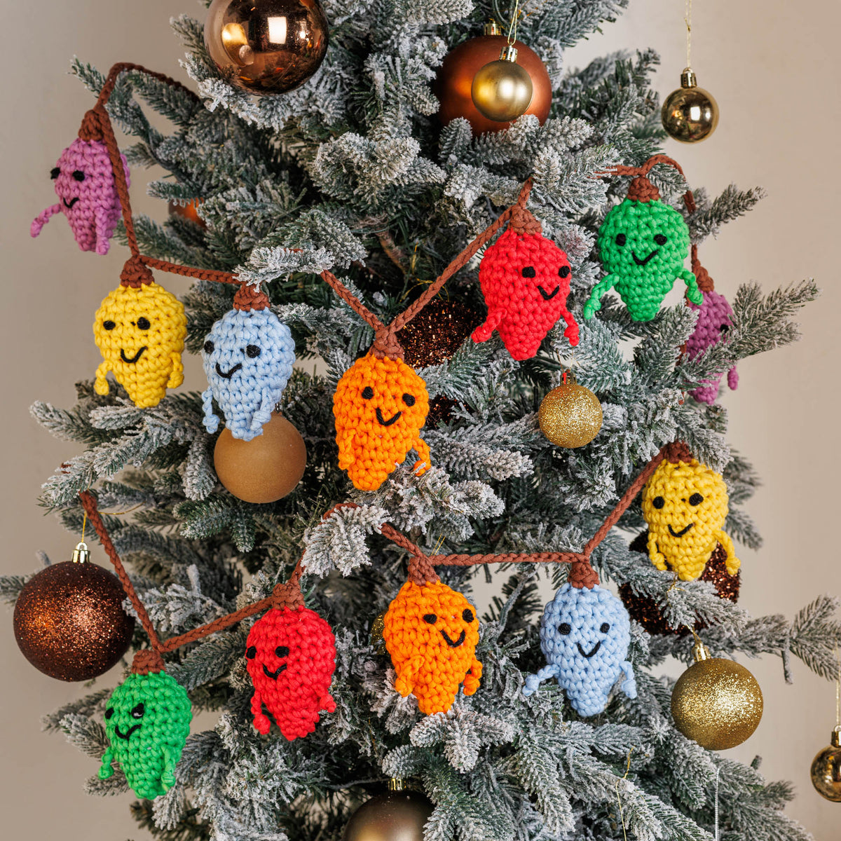Crochet Lightbulb Guys Garland made using Bernat yarn