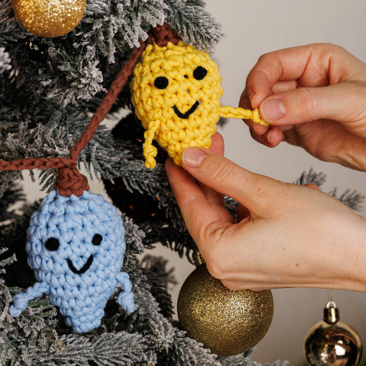 Crochet Lightbulb Guys Garland made using Bernat yarn