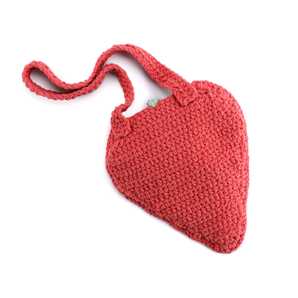 Plush Berry Crochet Bag made using Bernat yarn in a styled lifestyle setting
