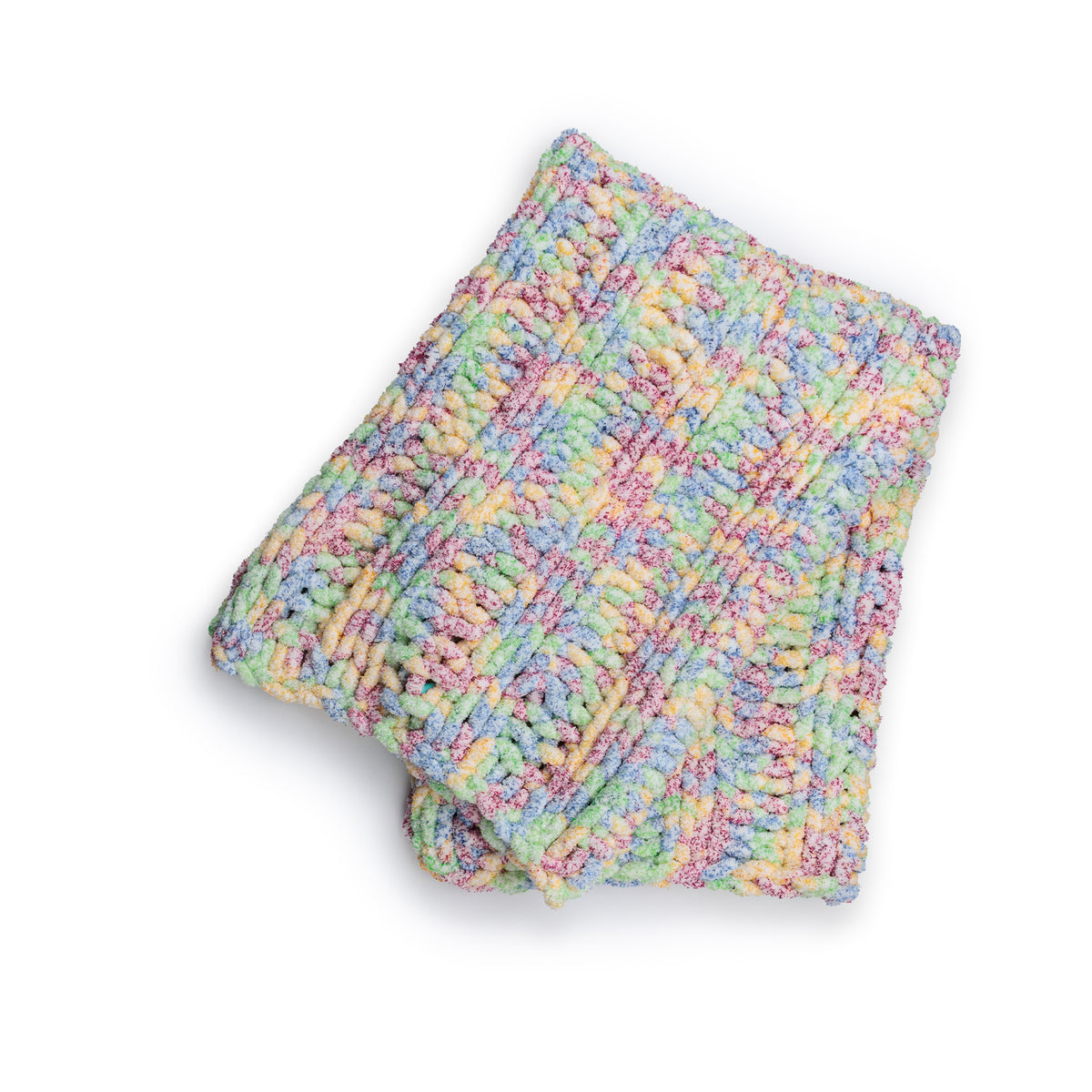 Simple Ribbing Table Knit Blanket made using Bernat yarn in a styled lifestyle setting