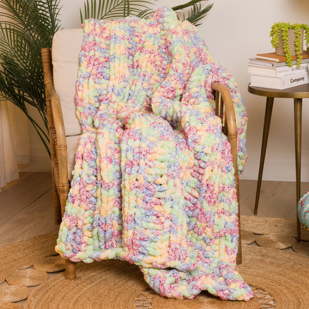 Simple Ribbing Table Knit Blanket made using Bernat yarn in a styled lifestyle setting