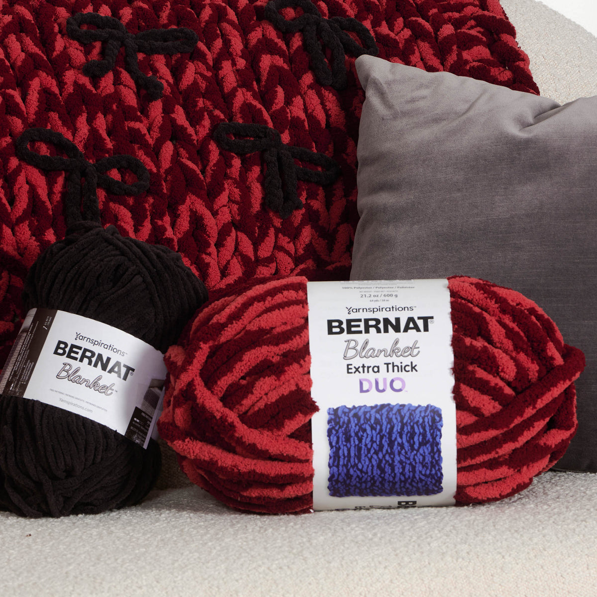 Put A Bow On It Table Knit Blanket made using Bernat yarn in a styled lifestyle setting