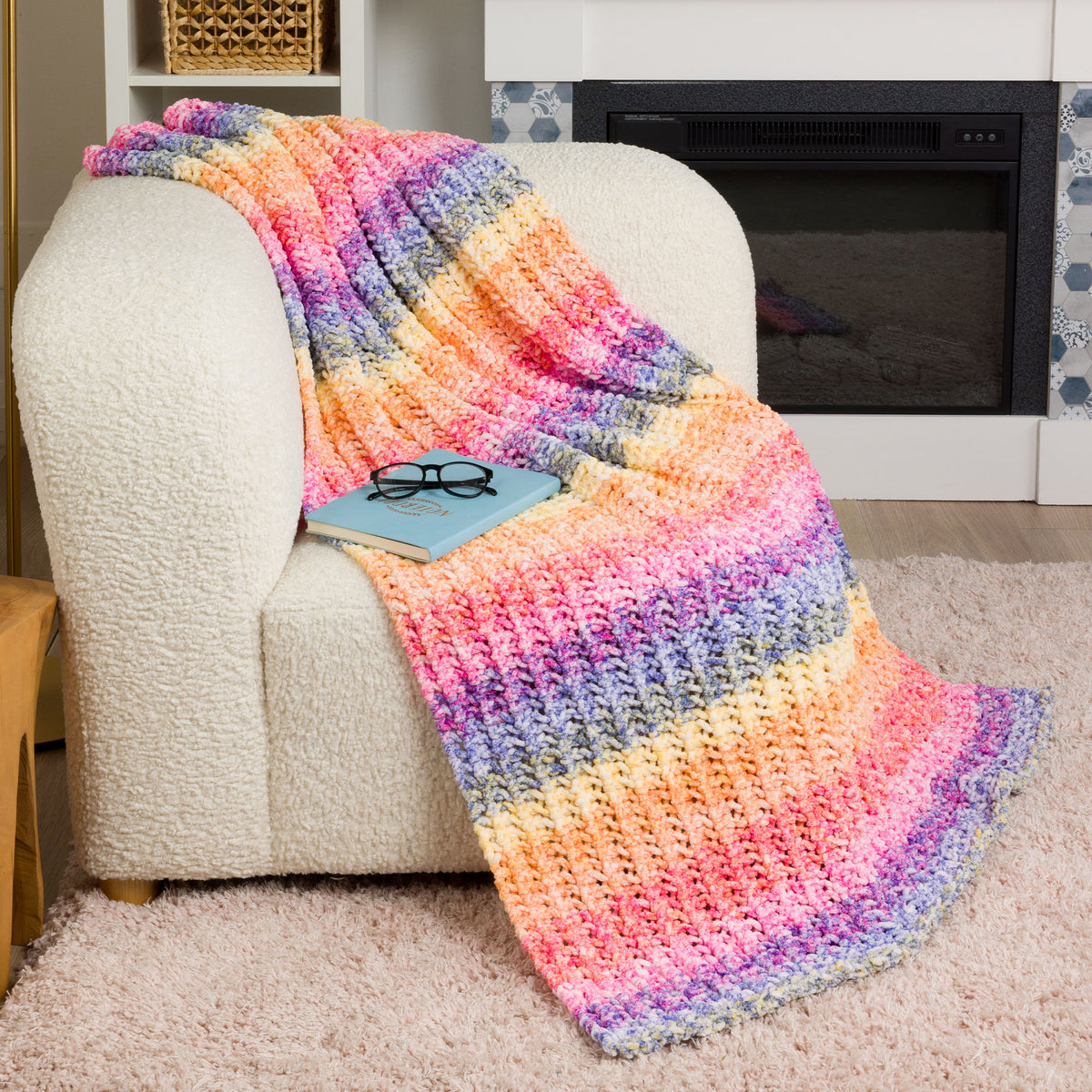 Eyelet Ridge Knit Blanket made using Bernat yarn in a styled lifestyle setting