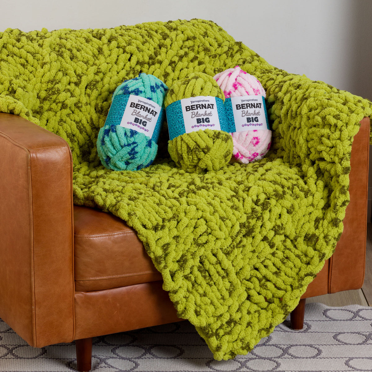 Woven Warmth Knit Blanket made using Bernat yarn in a styled lifestyle setting