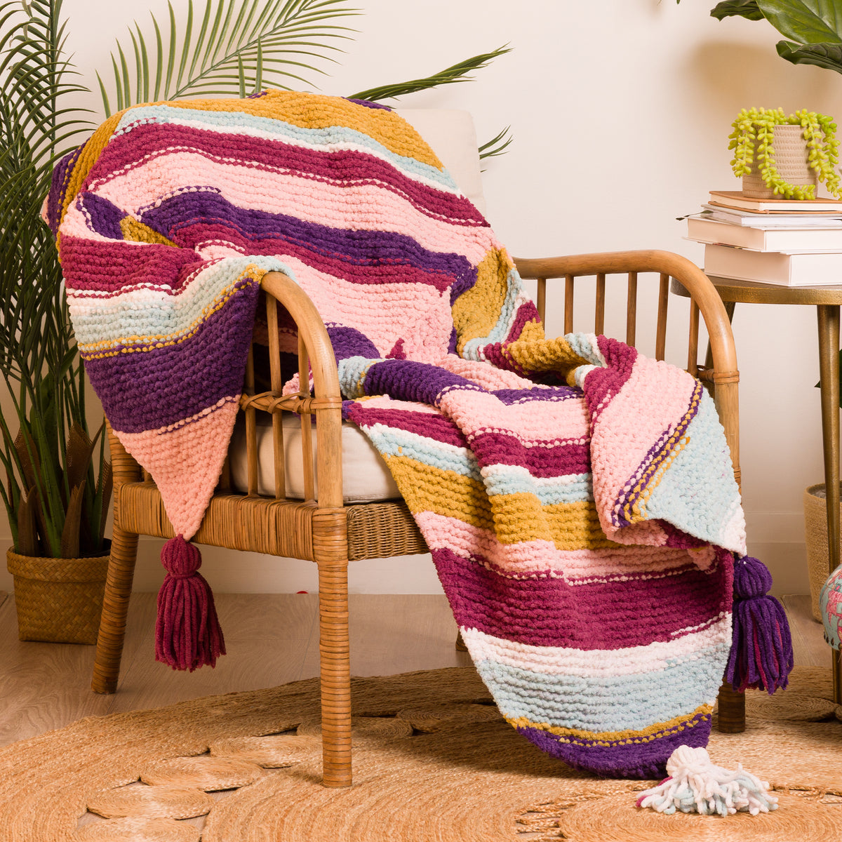 Quarter Stripes Knit Blanket made using Bernat yarn in a styled lifestyle setting
