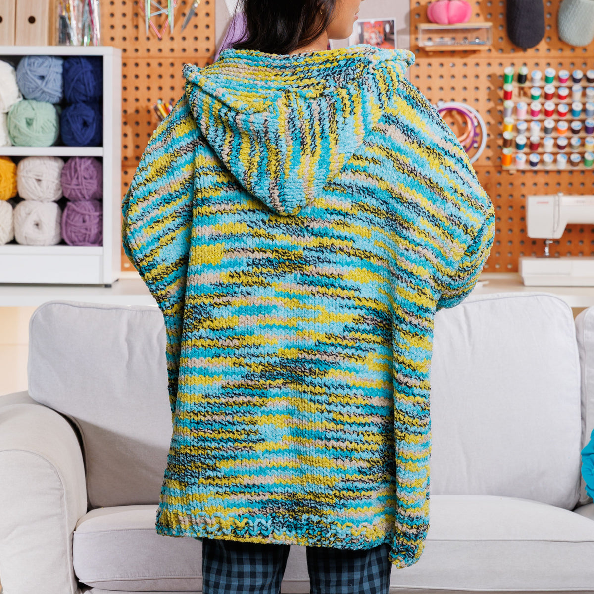 Couch Lounger Knit Hoodie made using Bernat yarn in a styled lifestyle setting