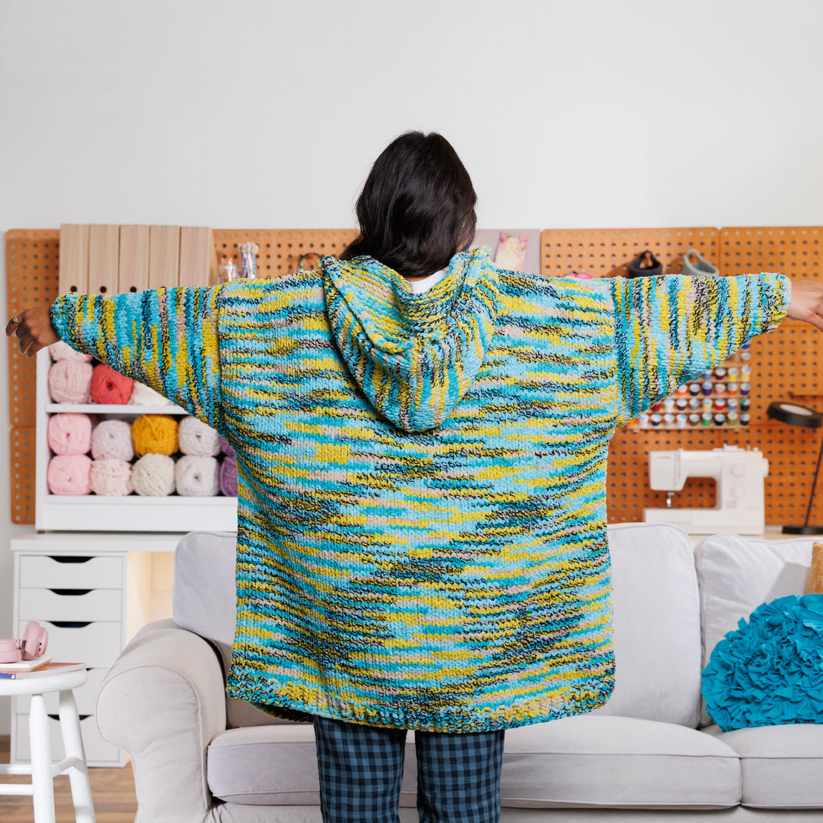Couch Lounger Knit Hoodie made using Bernat yarn in a styled lifestyle setting