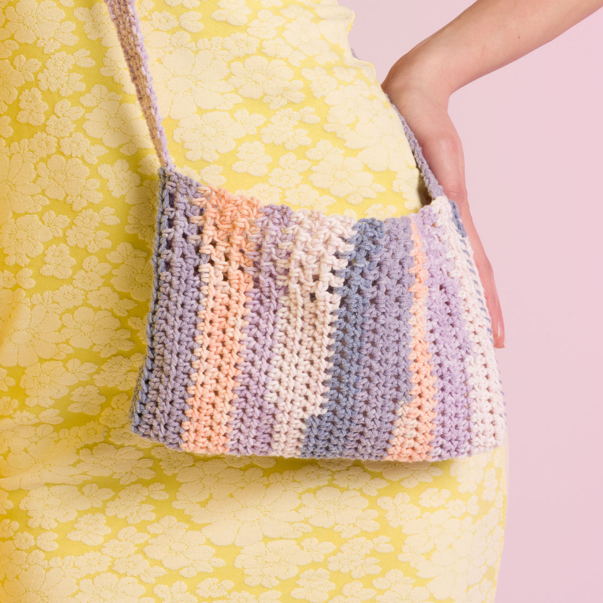 Crochet Cutie Cupcake Bag made using Caron yarn in a styled lifestyle setting