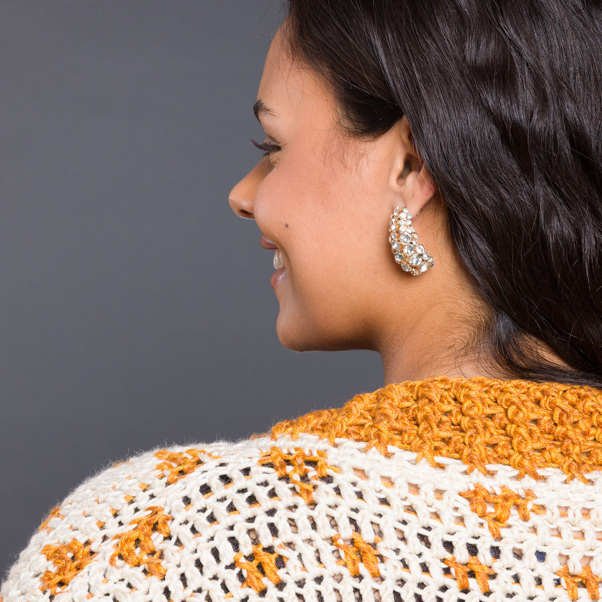 Diamond Dancer Crochet Cardigan made using Caron yarn in a styled lifestyle setting