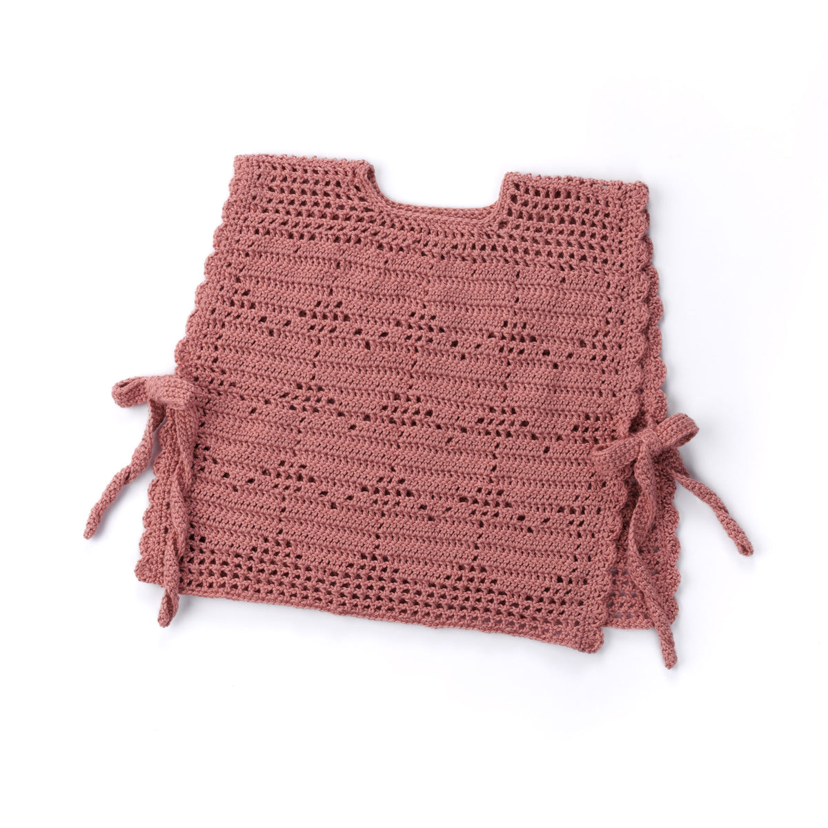 Crochet Filet Heart Vest made using Caron yarn in a styled lifestyle setting