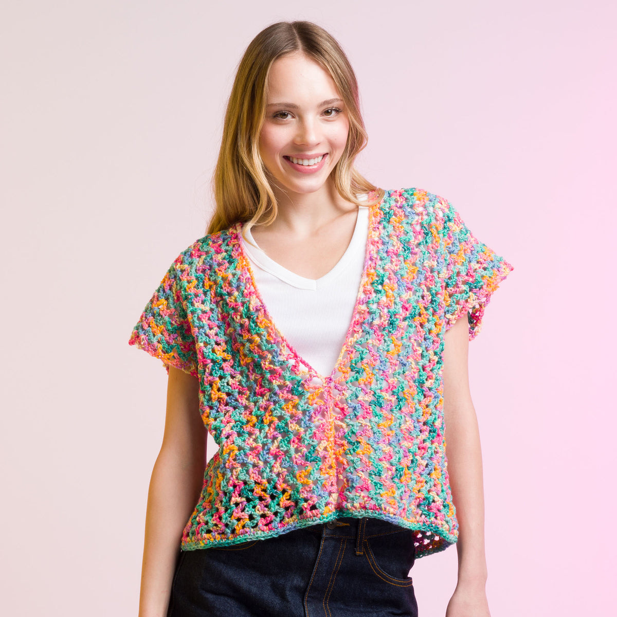 Crochet Side To Side Stripe Top made using Caron yarn in a styled lifestyle setting