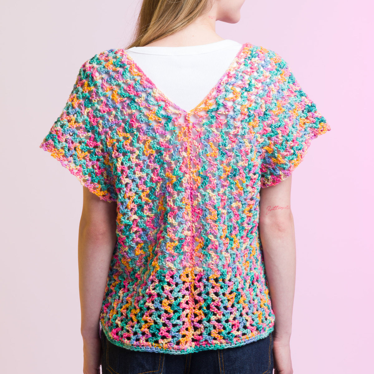 Crochet Side To Side Stripe Top made using Caron yarn in a styled lifestyle setting