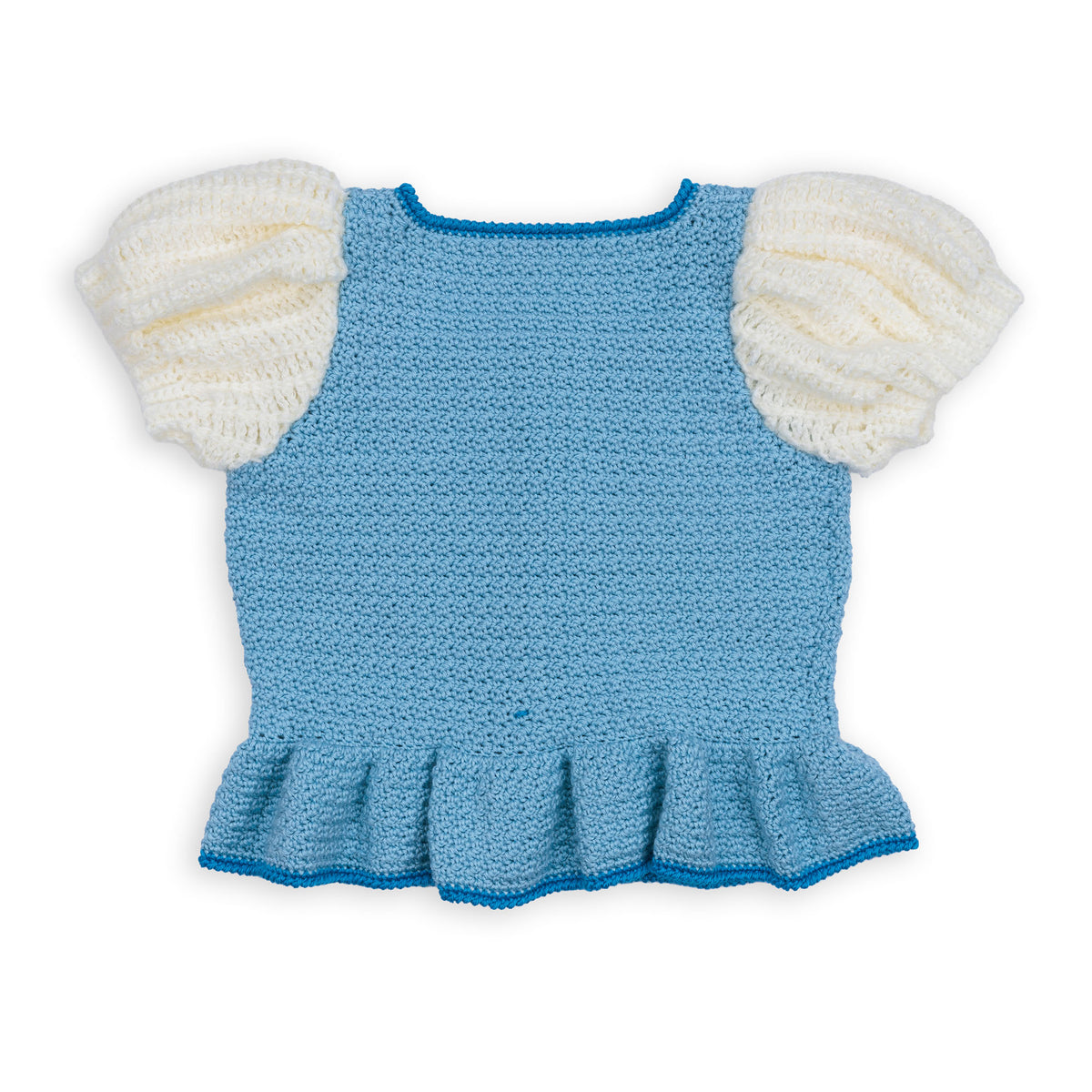 Crochet Luminous Top made using Caron yarn in a styled lifestyle setting