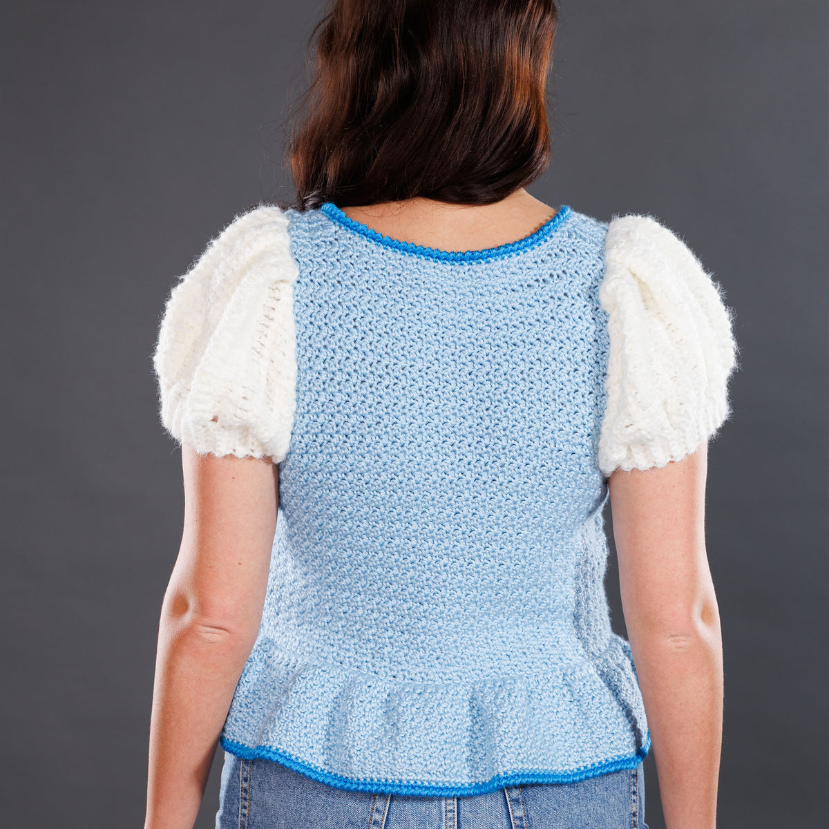 Crochet Luminous Top made using Caron yarn in a styled lifestyle setting