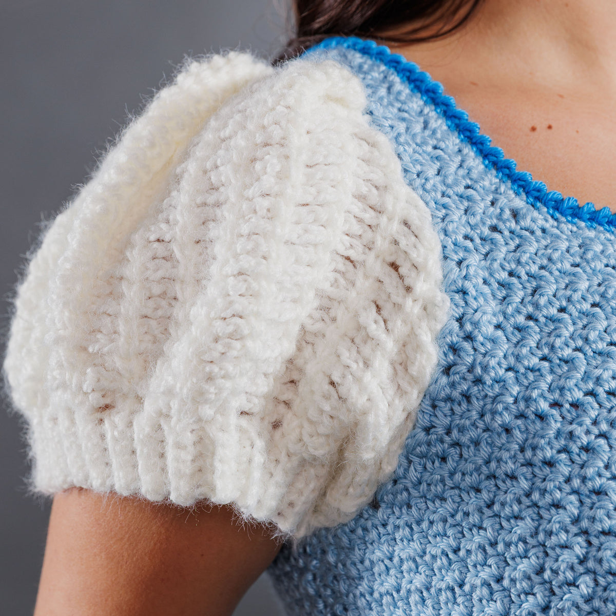 Crochet Luminous Top made using Caron yarn in a styled lifestyle setting