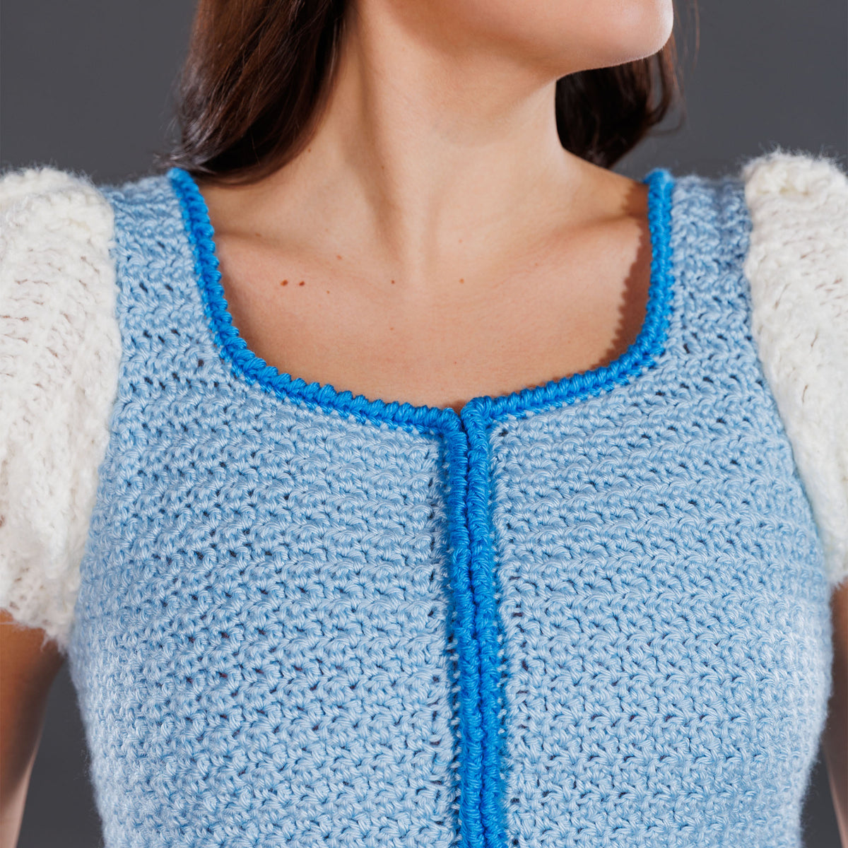 Crochet Luminous Top made using Caron yarn in a styled lifestyle setting