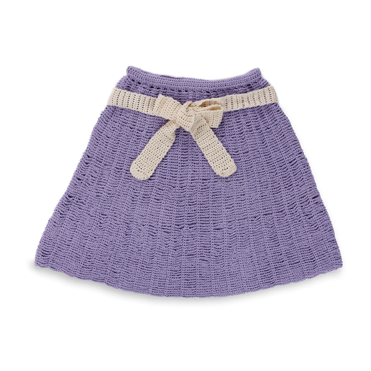 Crochet Lacy Days Skirt And Belt made using Caron yarn in a styled lifestyle setting
