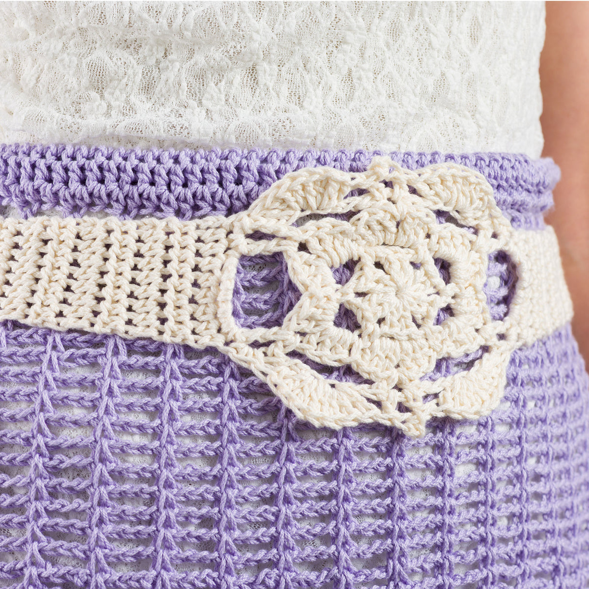 Crochet Lacy Days Skirt And Belt made using Caron yarn in a styled lifestyle setting
