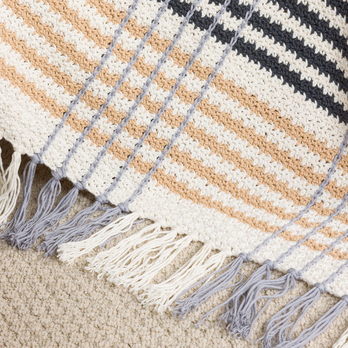 All Day Plaid Crochet Throw made using Caron yarn
