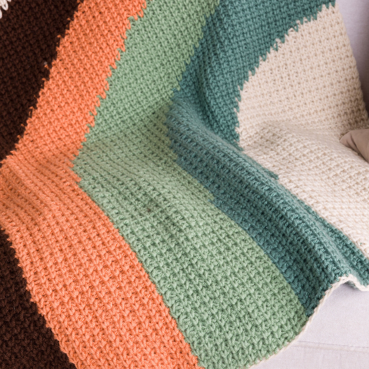 Calm Current Crochet Blanket made using Caron yarn