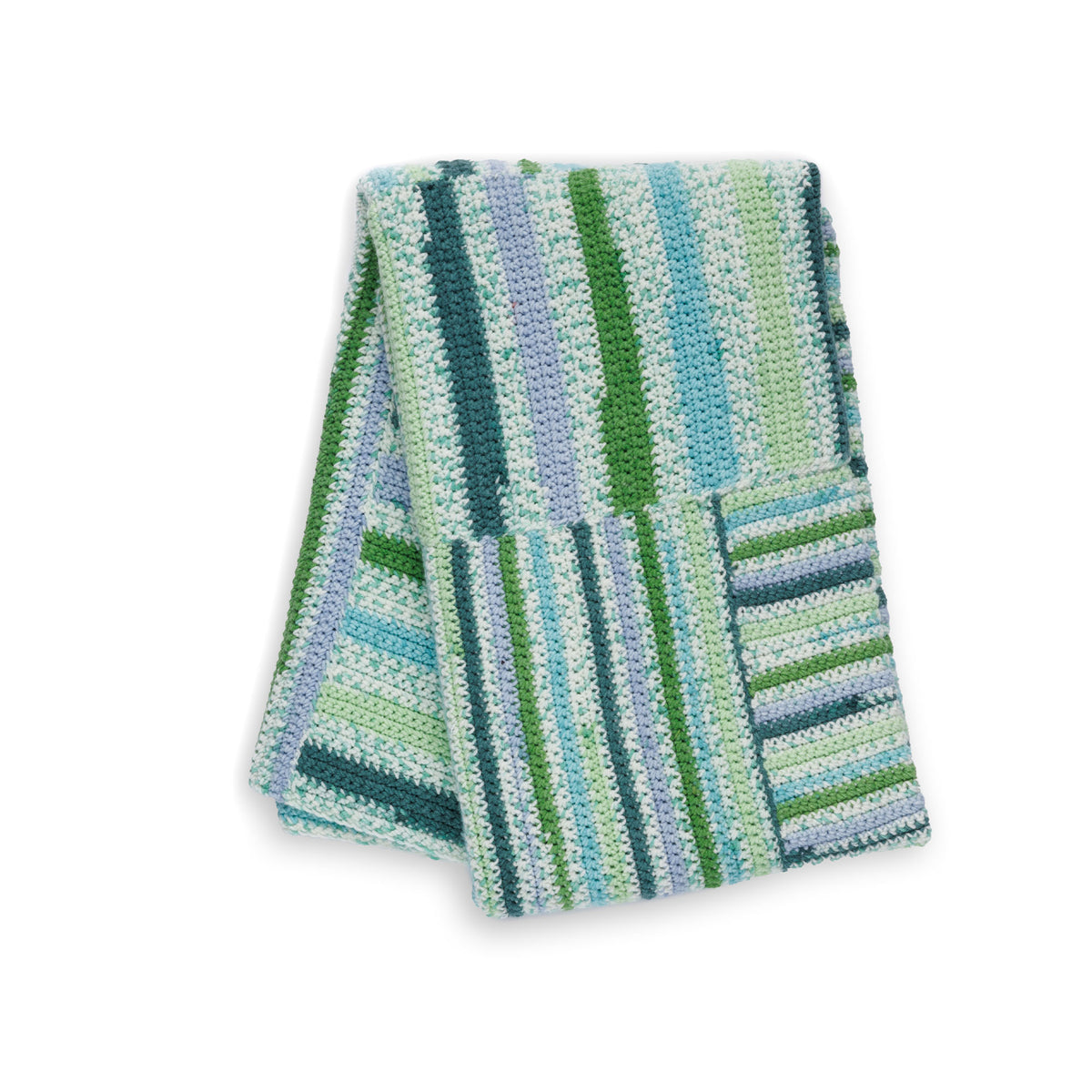 Crochet Every Way Blanket made using Caron yarn in a styled lifestyle setting