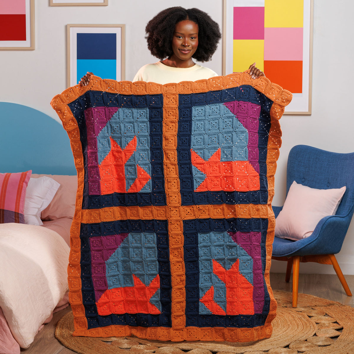 Crochet Feline Framework Quilt made using Caron yarn in a styled lifestyle setting