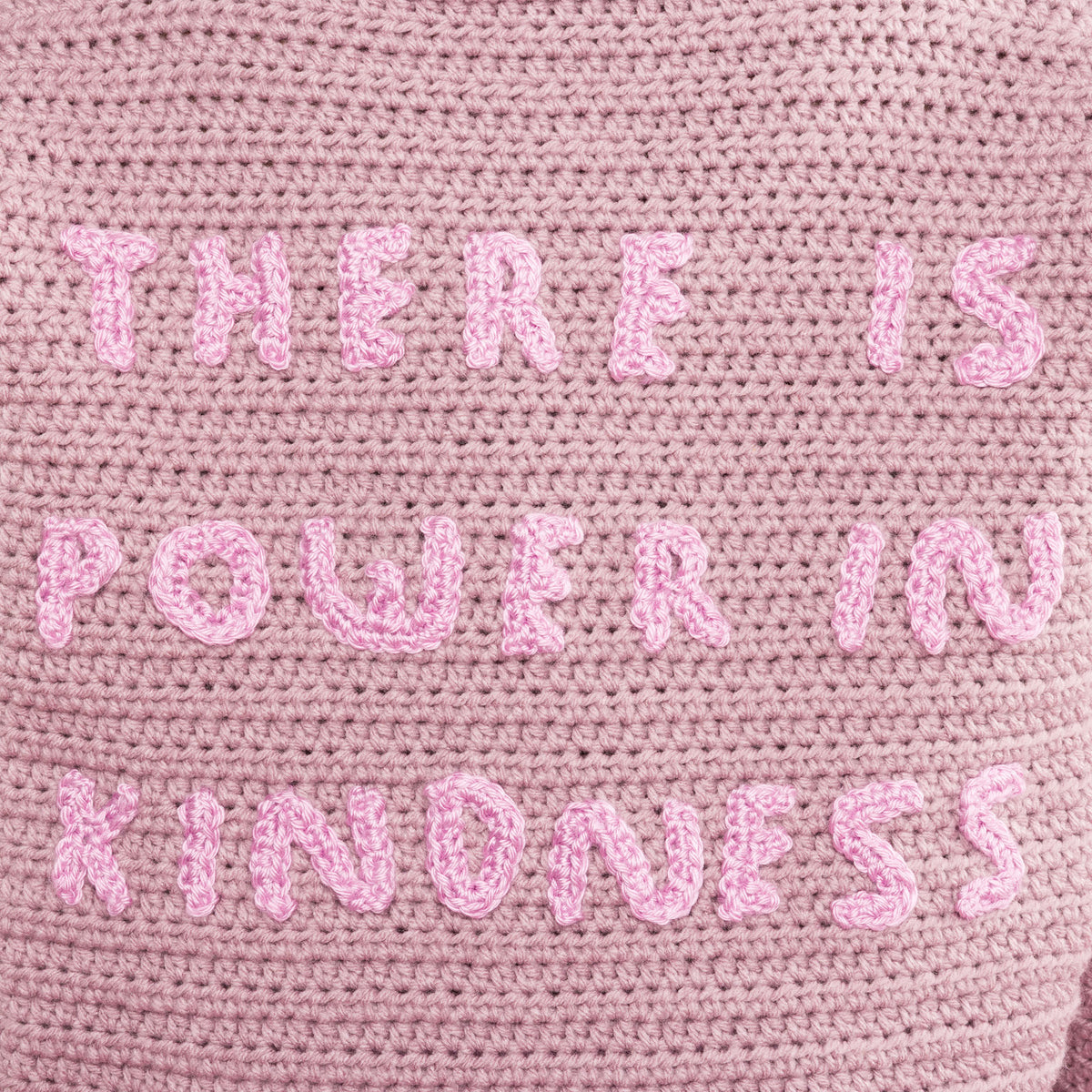 Shimmering Phrase On Crochet Pullover made using Caron yarn in a styled lifestyle setting