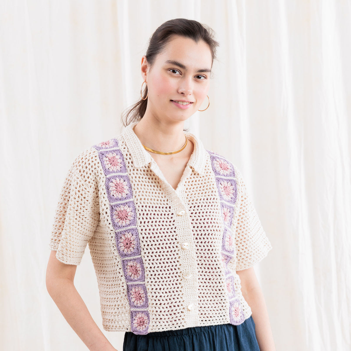 Crochet Cabana Shirt With Detail made using Caron yarn in a styled lifestyle setting