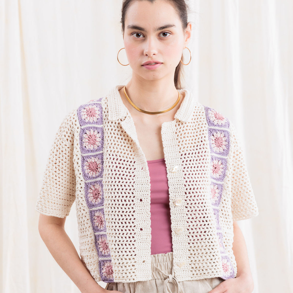 Crochet Cabana Shirt With Detail made using Caron yarn in a styled lifestyle setting