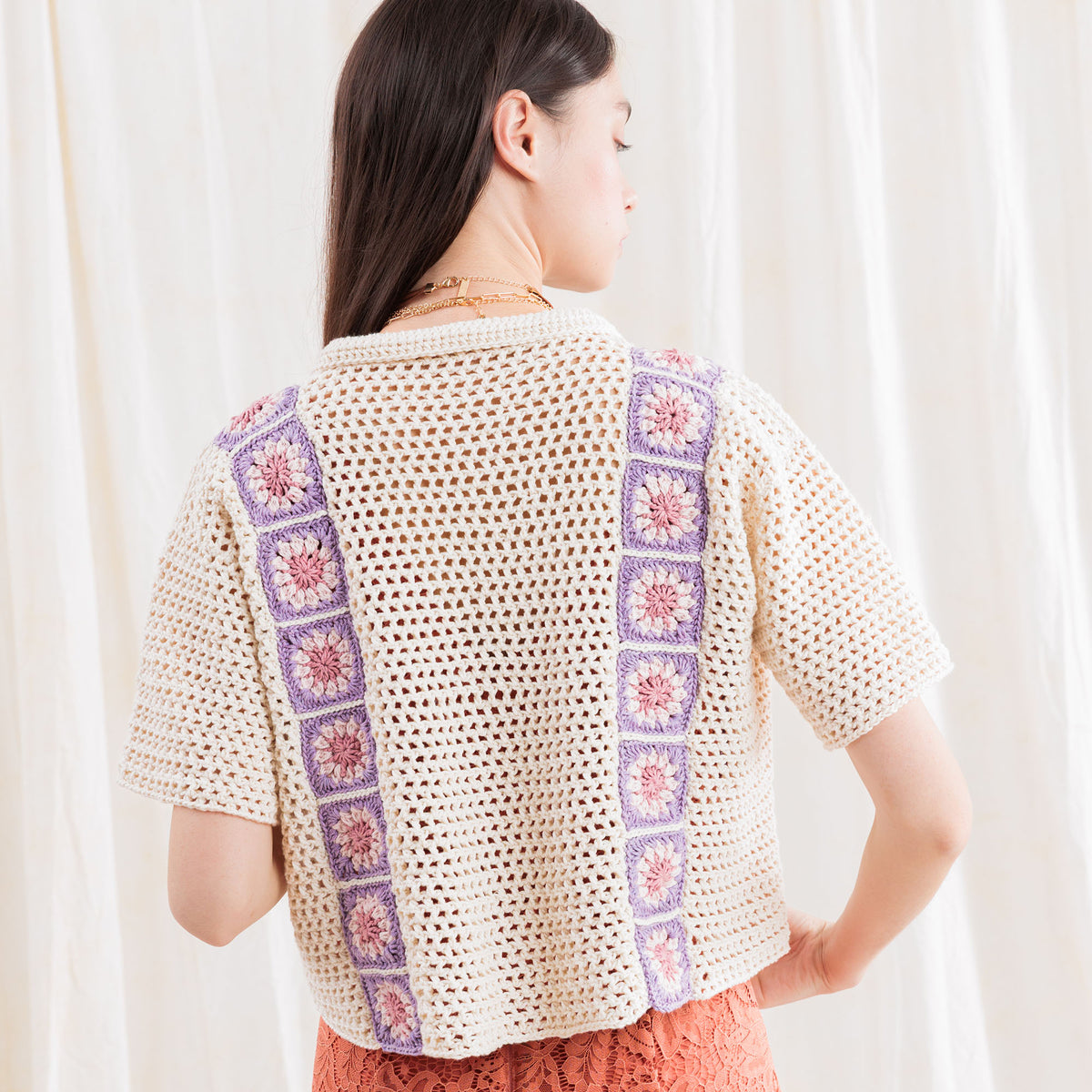 Crochet Cabana Shirt With Detail made using Caron yarn in a styled lifestyle setting