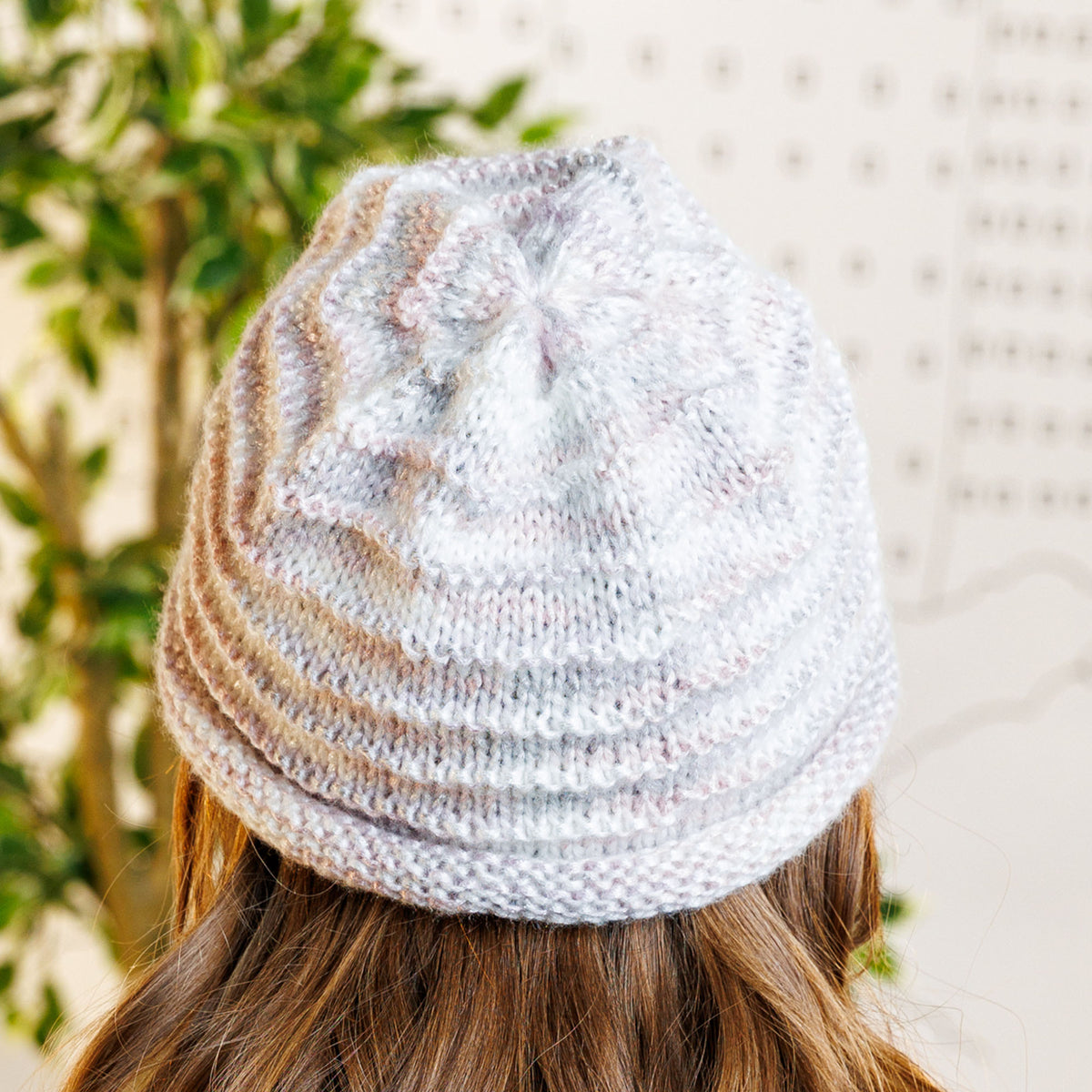 Garter Ridges Minimalist Knit Beanie made using Caron yarn in a styled lifestyle setting