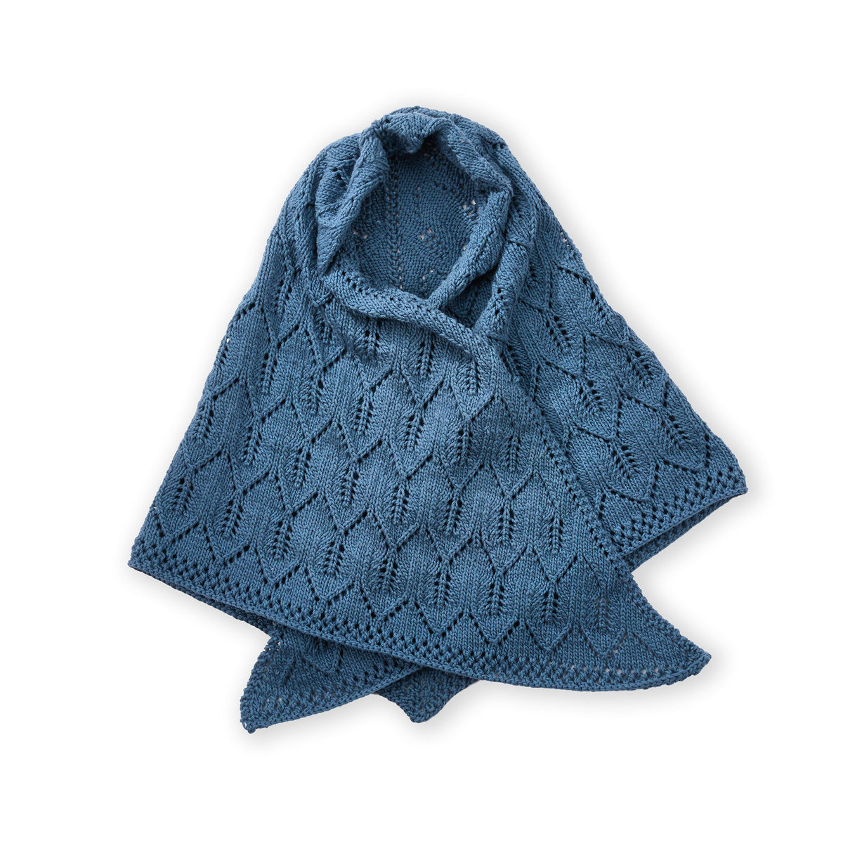 Ocean Waves Knit Shawl made using Caron yarn in a styled lifestyle setting